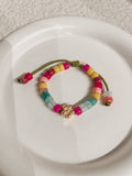 Flower Magenta Beads Bracelet on Chattreuse Cord